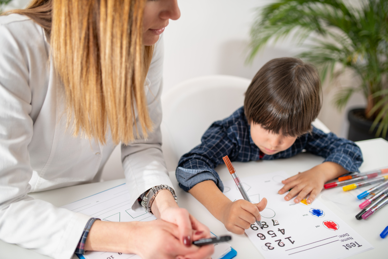 Young Mind At Work As A Toddler Engages In A Captivating Psychology Test, Showcasing Their Logical Abilities With Numbers And Fostering Early Cognitive Development